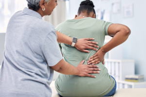 A woman's back pain is diagnosed at Arrowhead Clinic 